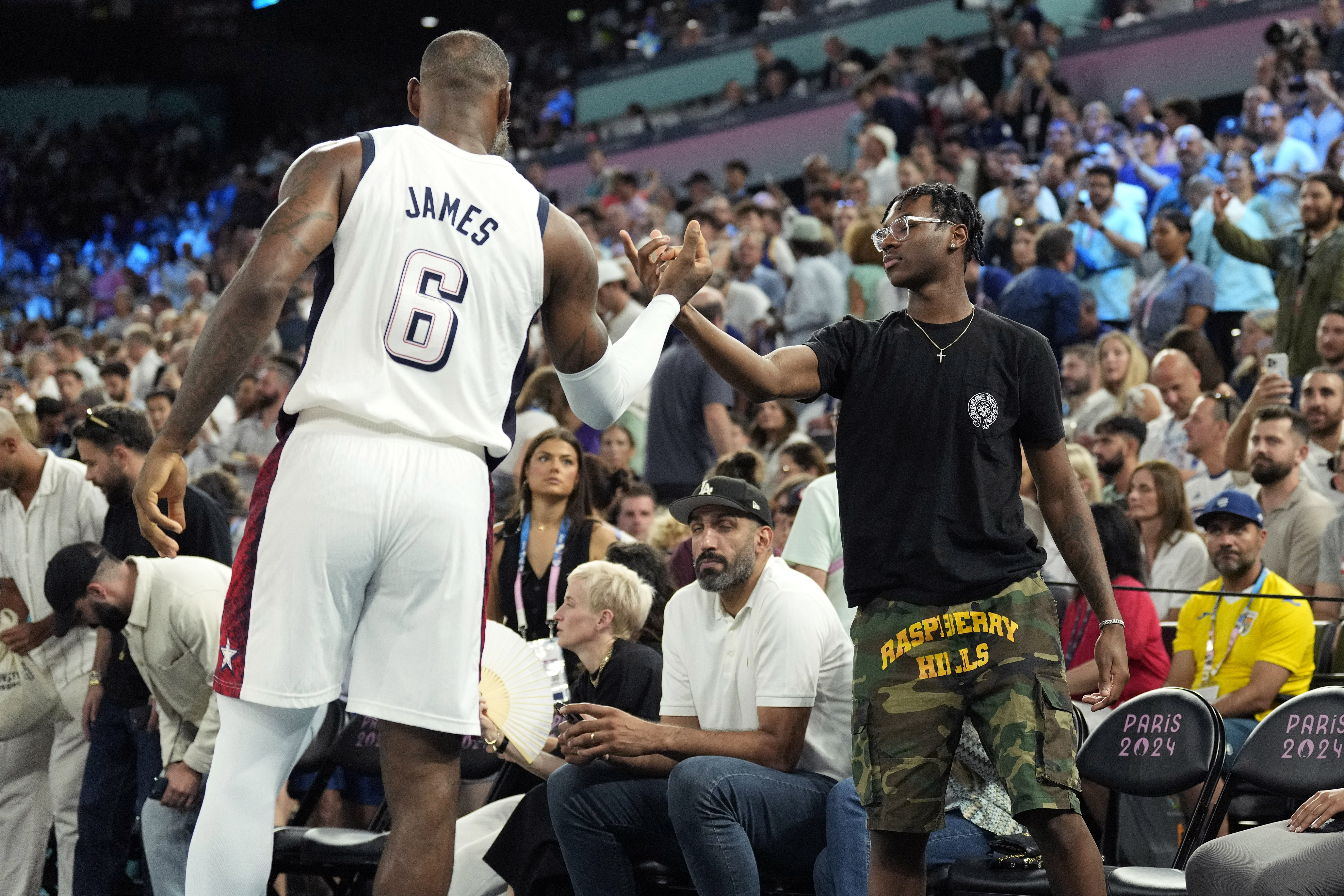 Bryce James (R) and his father LeBron James - Source: Imagn
